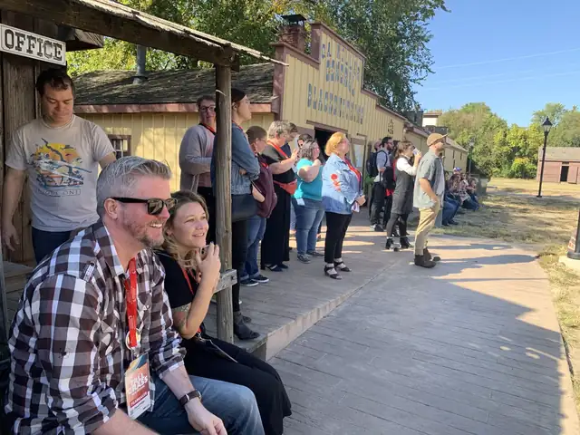 A tour group on the boardwalk at Old Cowtown Museum